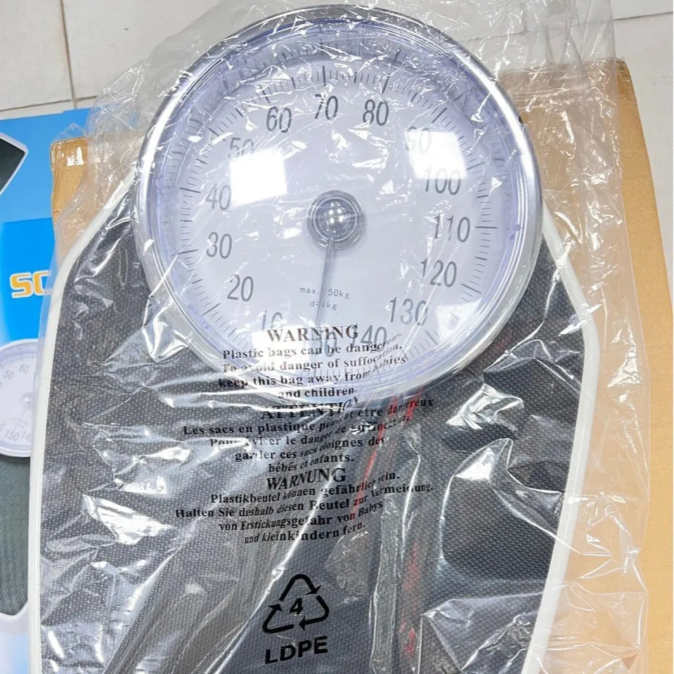 Black mechanical pointer body weight scale with large dial display measuring 47x35x11cm