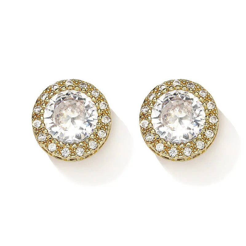 Round copper stud earrings with inlaid zircon in gold tone on white background