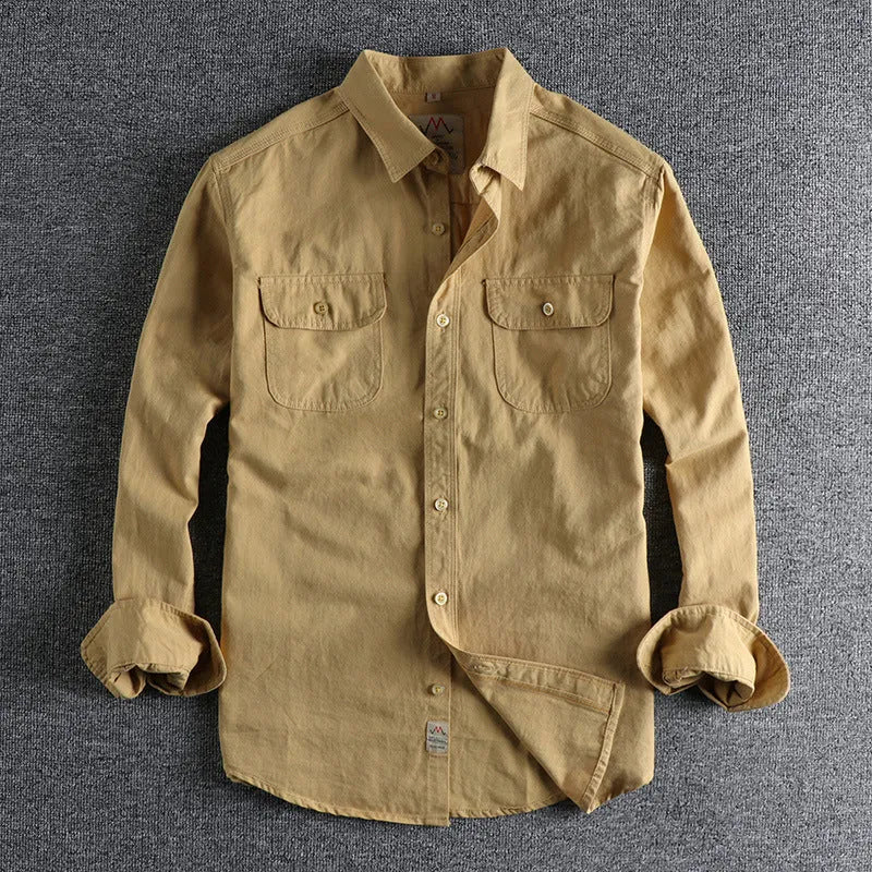 Men's solid colour long sleeve cotton shirt in cardigan style, shown in light blue.