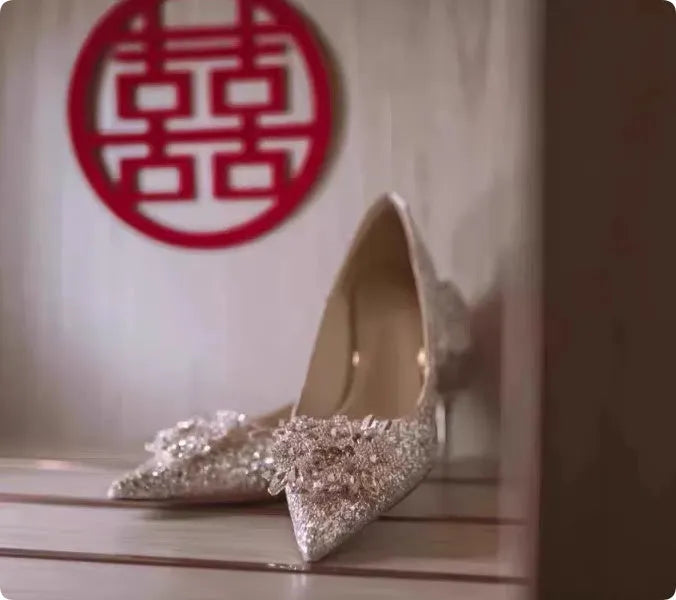 Champagne pointed toe wedding shoes with crystal rhinestone detail on a fine high heel.