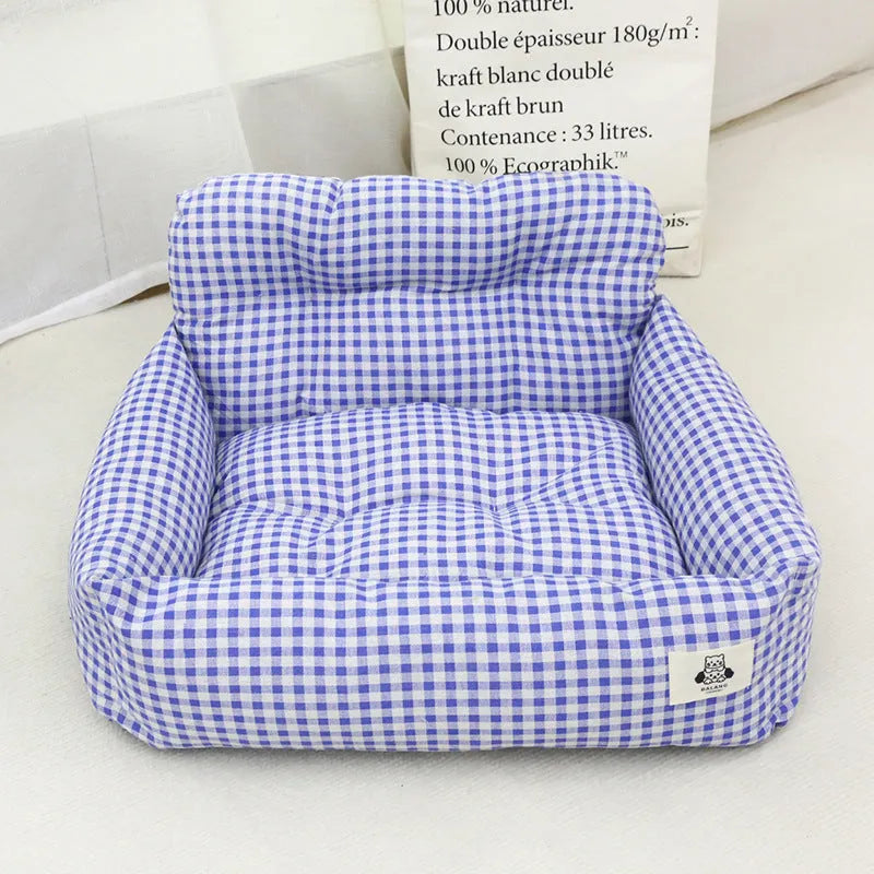 Car-mounted pet travel nest in stain-resistant cloth, showing grey and blue plaid options with size dimensions