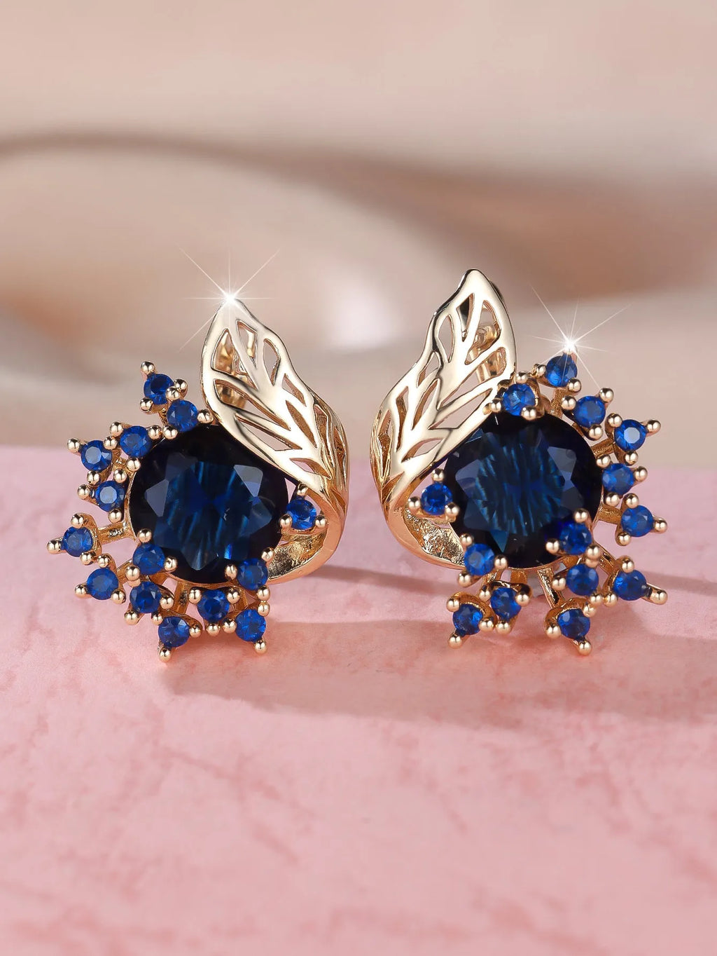 Round floral feather earrings in rose gold colour with crystal zircon stones, shown in six colour variations