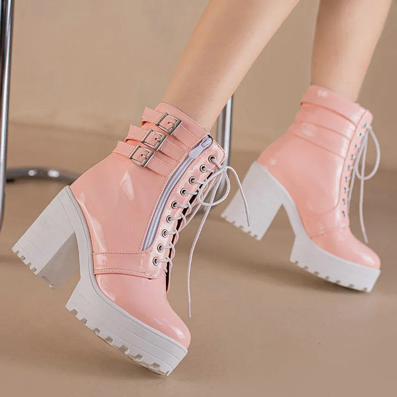 Women's black thick-heel ankle boots with round toe and front lace-up design.
