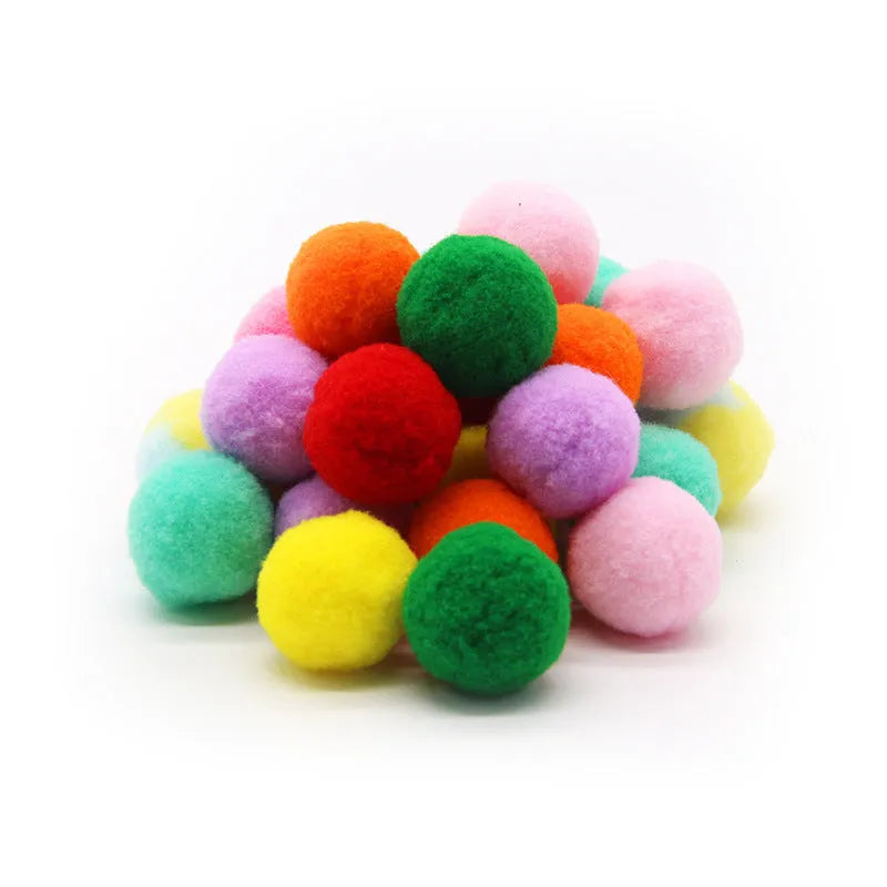 Plush cat toy launch gun with soft yarn balls for interactive indoor pet play.
