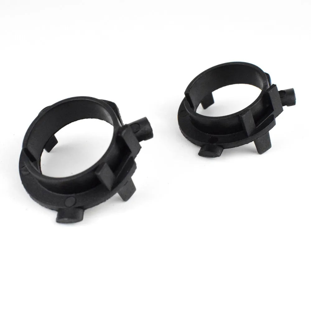 Black ABS plastic car headlight card holder for Nissan and Kia models showing compact size