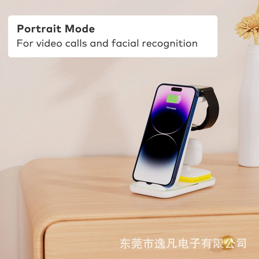 Black vertical wireless charging stand holding phone upright with smartwatch and headset charging