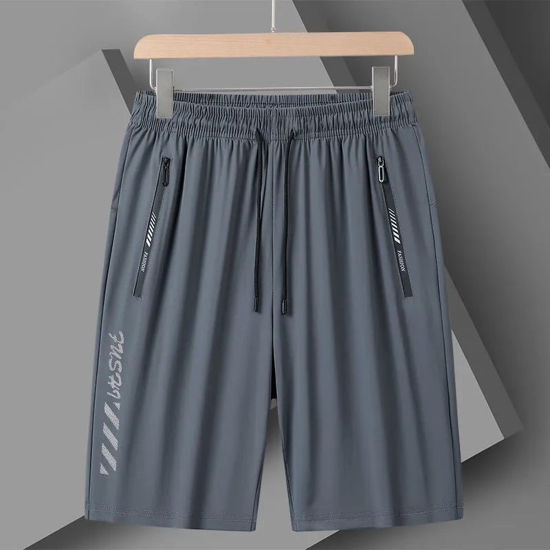 Men's black quick-dry nylon sports shorts with loose fit and fifth pants length on hanger