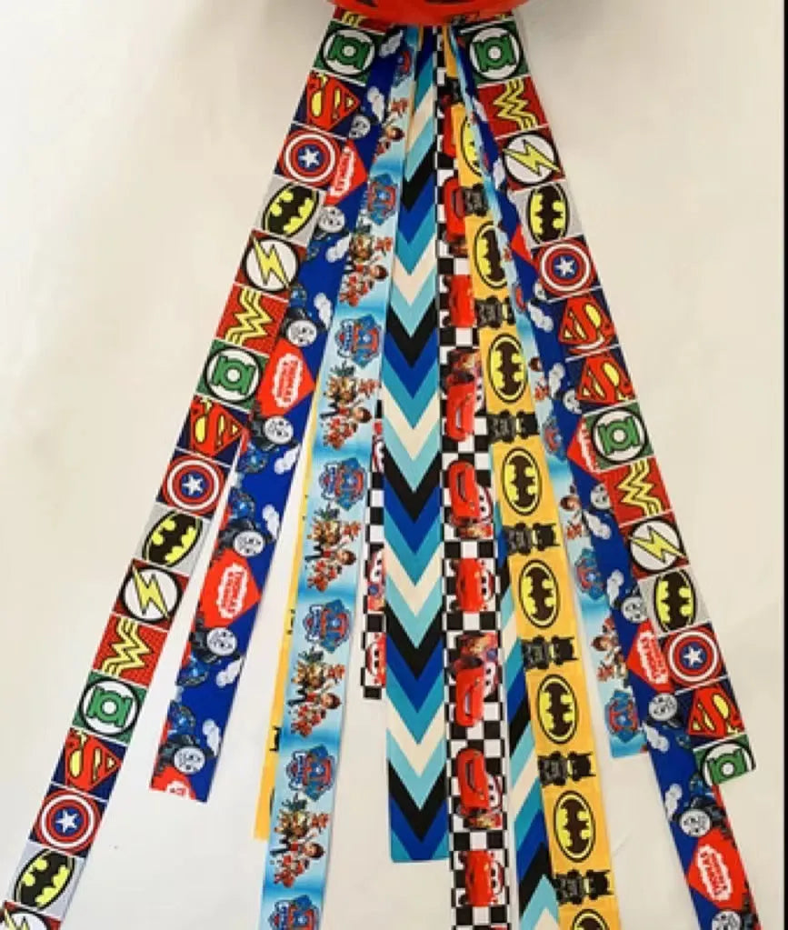 A colourful helmet streamer accessory for children's sports helmets and doll decoration.