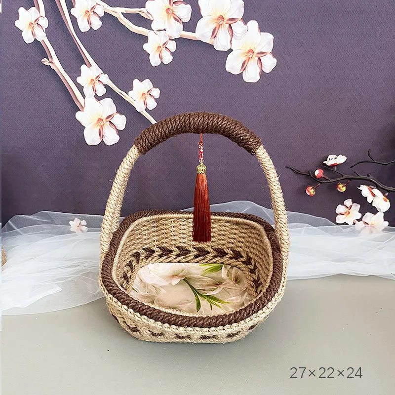 Small hand-woven straw basket in coffee brown colour on a wooden table.