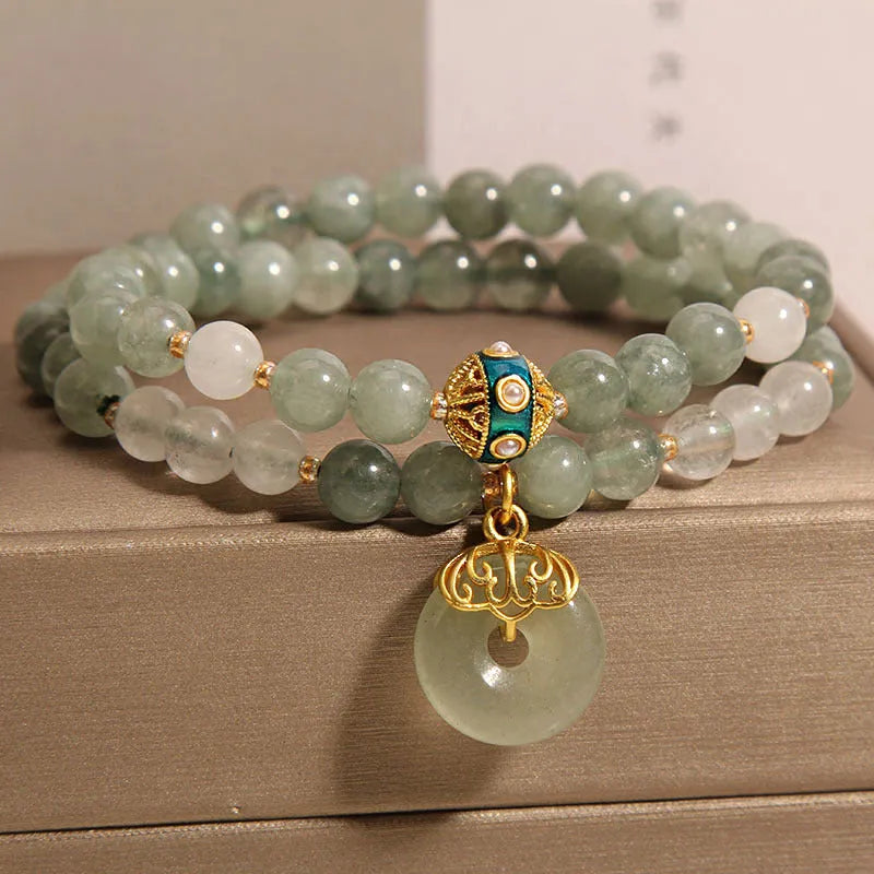 Women's double-layer aventurine jade bracelet with safety buckle and rhinestones.