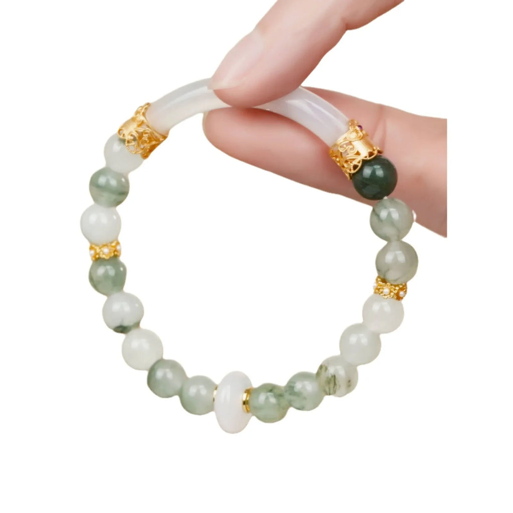 Emerald green jade bracelet with floating flower girl design in a half bracelet style.