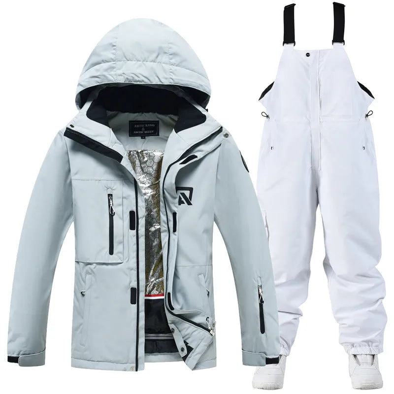 Men's and women's waterproof winter ski suit in blue top with grey blue trousers.
