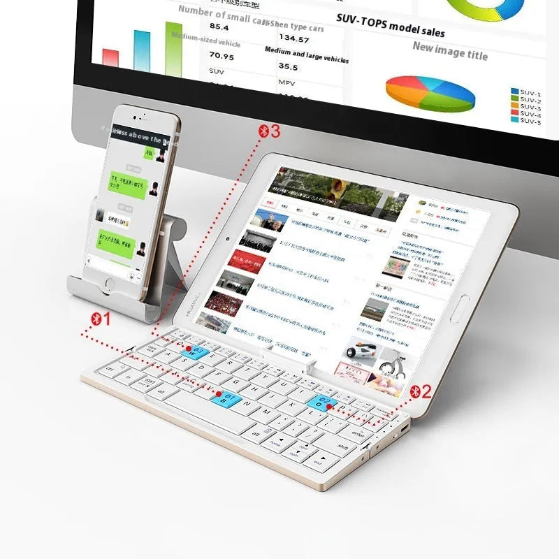Folding Bluetooth keyboard in black gray for tablets and phones on a plain background