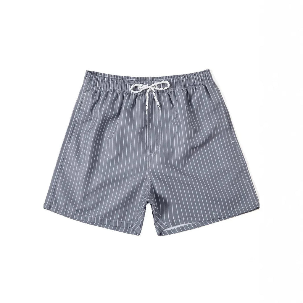 Polyester fibre beach shorts with digital printed striped triangle lining in straight leg style