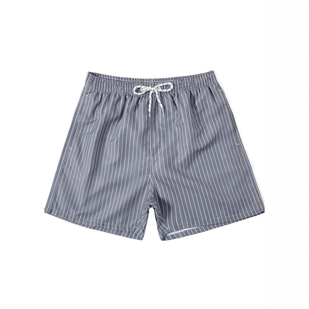 Polyester fibre beach shorts with digital printed striped triangle lining in straight leg style