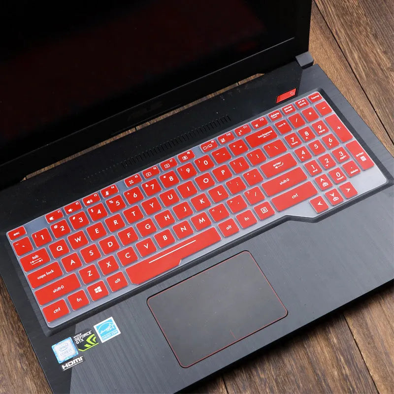 Clear protective keyboard film cover for ASUS Flight 14-inch laptop on a keyboard.
