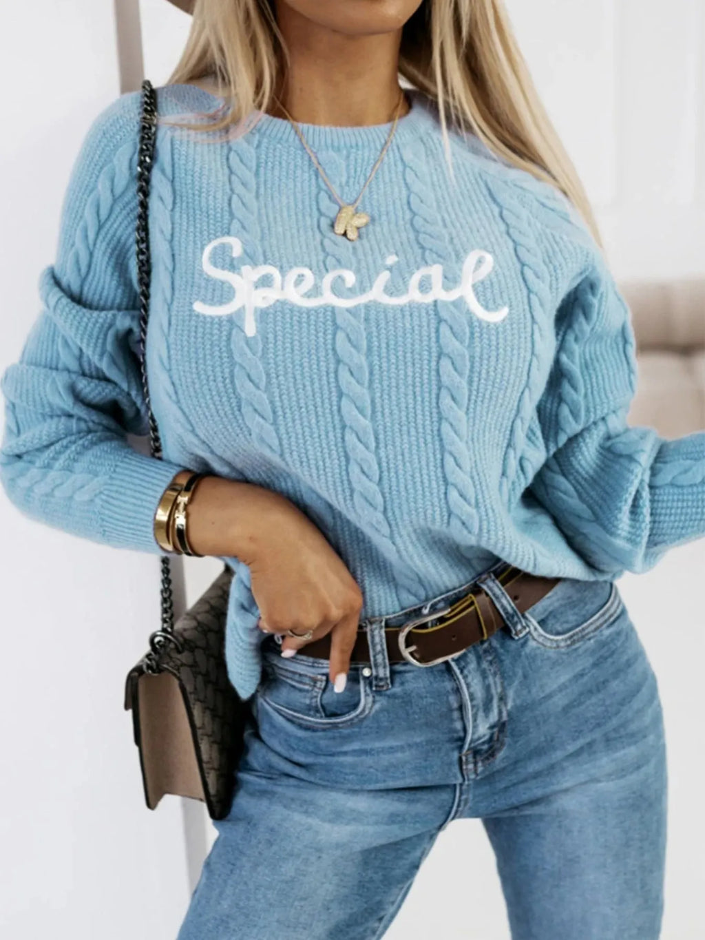 Blue crew neck pullover sweater with embroidered letters and numbers design