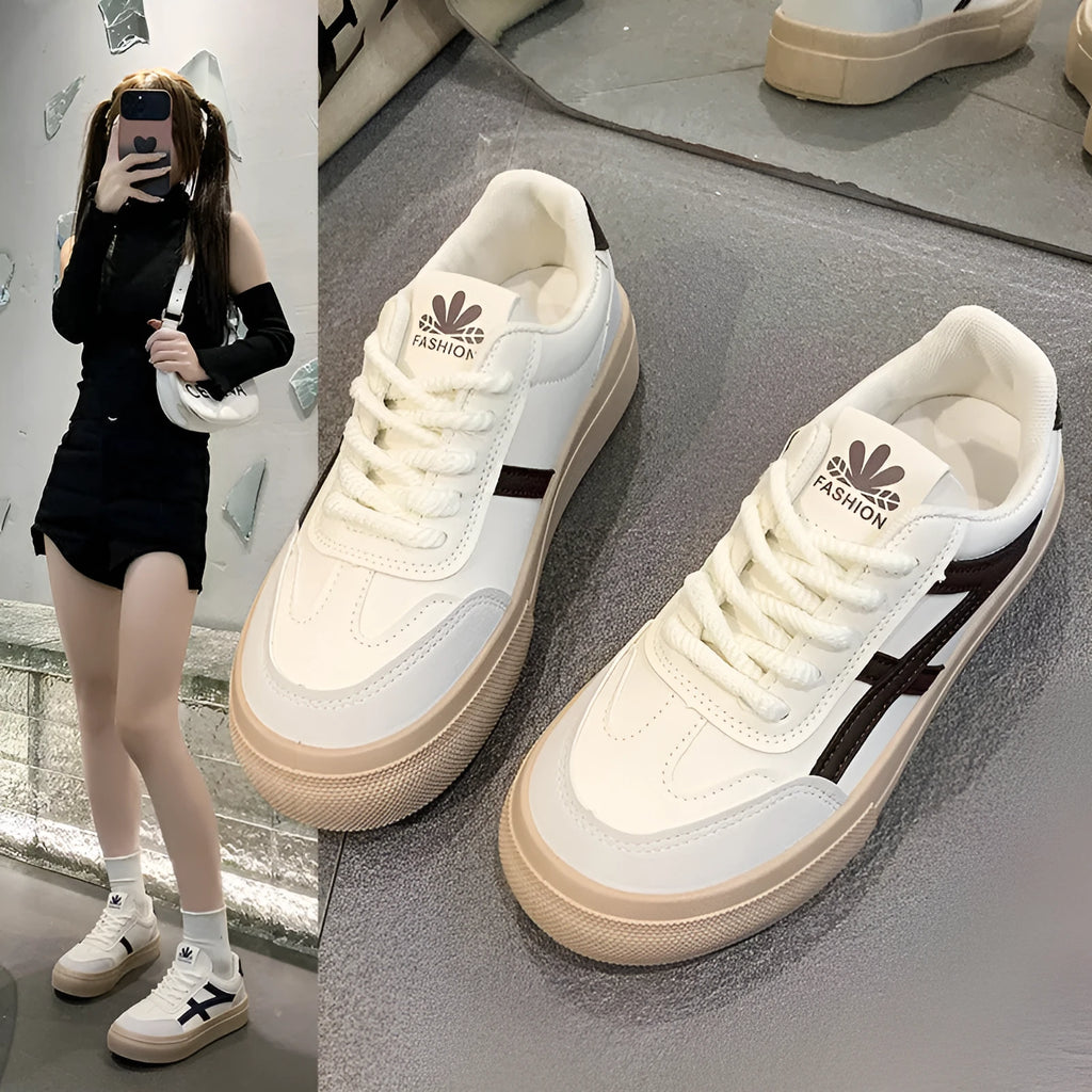 Low top blue board shoes with round toe and flat rubber sole on white background