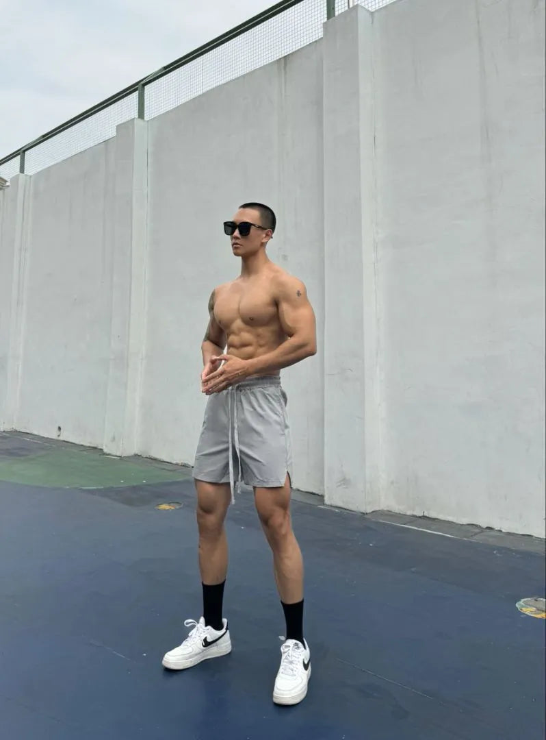 Men's ice silk quick-drying double-layer casual shorts in nylon fabric on a colour swatch background.