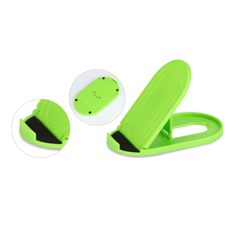 Plastic lazy bracket mobile phone stand in multiple colours on a desk