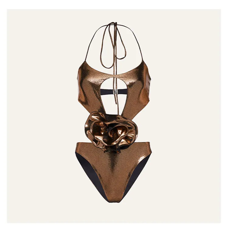 Gold coloured handmade one-piece swimsuit with halter neck and hollow out pattern.