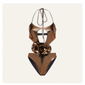 Gold coloured handmade one-piece swimsuit with halter neck and hollow out pattern.