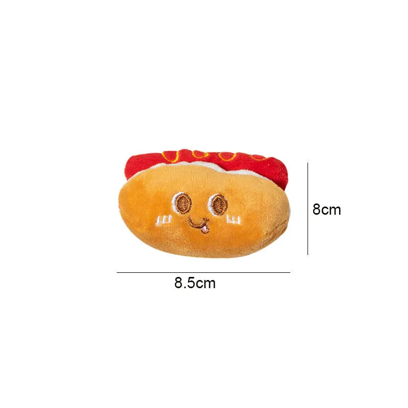Assorted fast food shaped cat chewing toys including hamburger, chicken leg, bread, fries, and hot dog designs