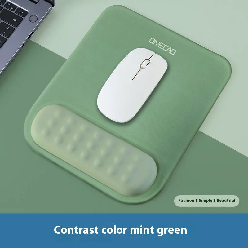 Ergonomic cloth silicone mouse pad with raised wrist support in mint green colour.