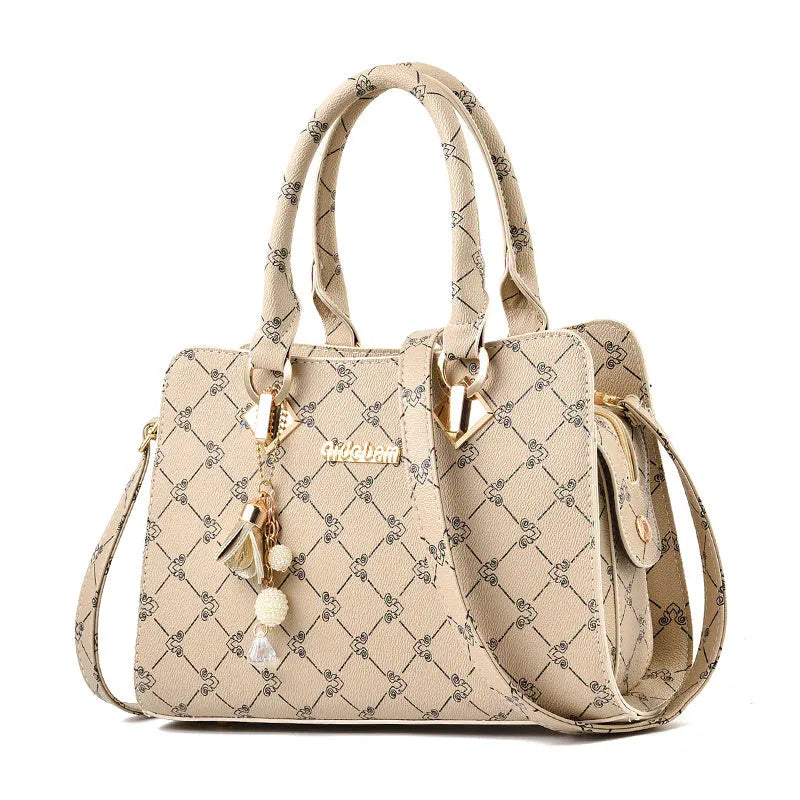 Women's geometric print messenger bag in PU material with internal organisation pockets and zipper closure