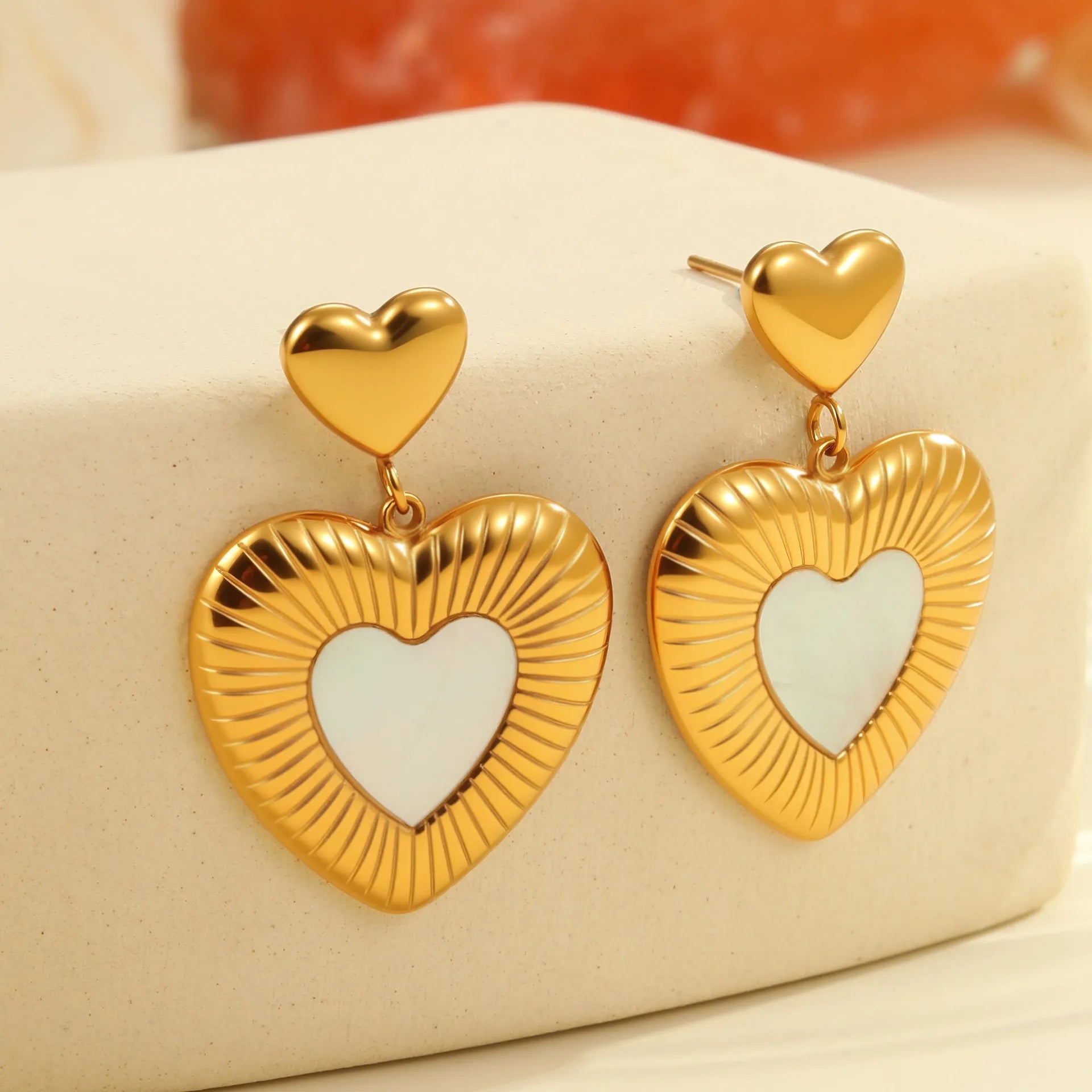 Stainless steel heart shape earrings with fritillary pattern and gold electroplating