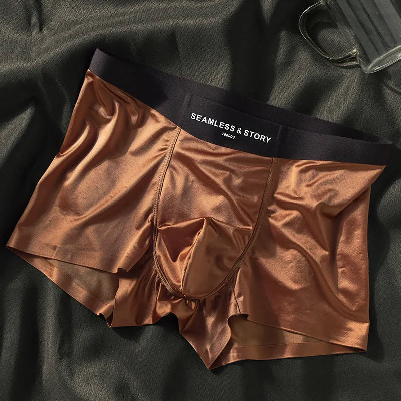 Men's solid colour ice silk nylon underwear in mid waist design on a neutral background.