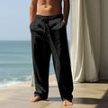 Men's loose-fit cotton casual trousers in a solid colour on a hanger.