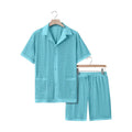 Lake blue see-through beach dress with matching cardigan and shorts set on a model.