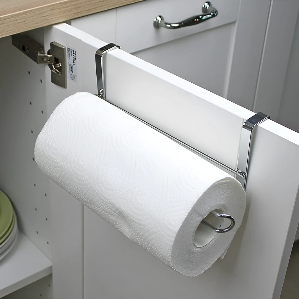 Silver stainless steel paper towel rack mounted on a kitchen cabinet door