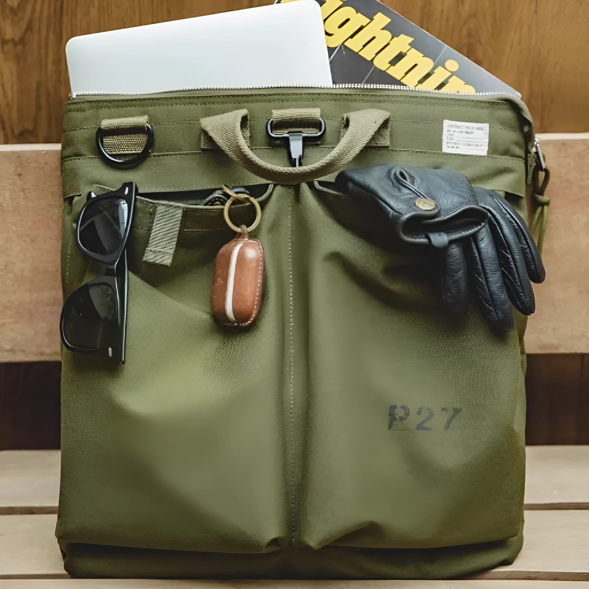 Retro style canvas crossbody messenger bag in military green with adjustable shoulder strap and zipper closure