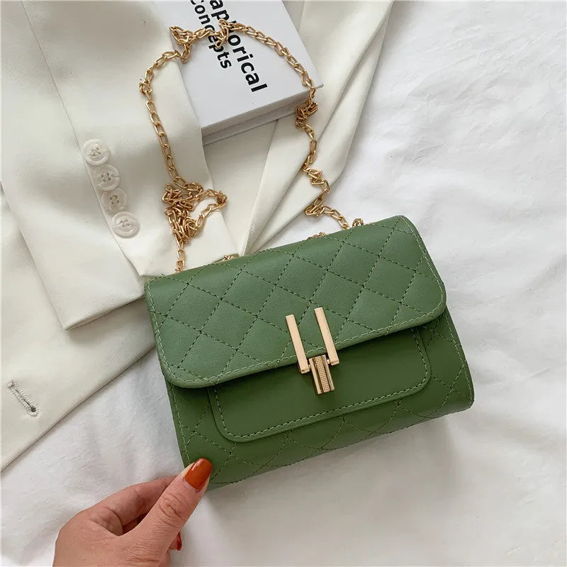Women's diamond lattice chain crossbody bag in PU leather with adjustable strap in black, white, or green