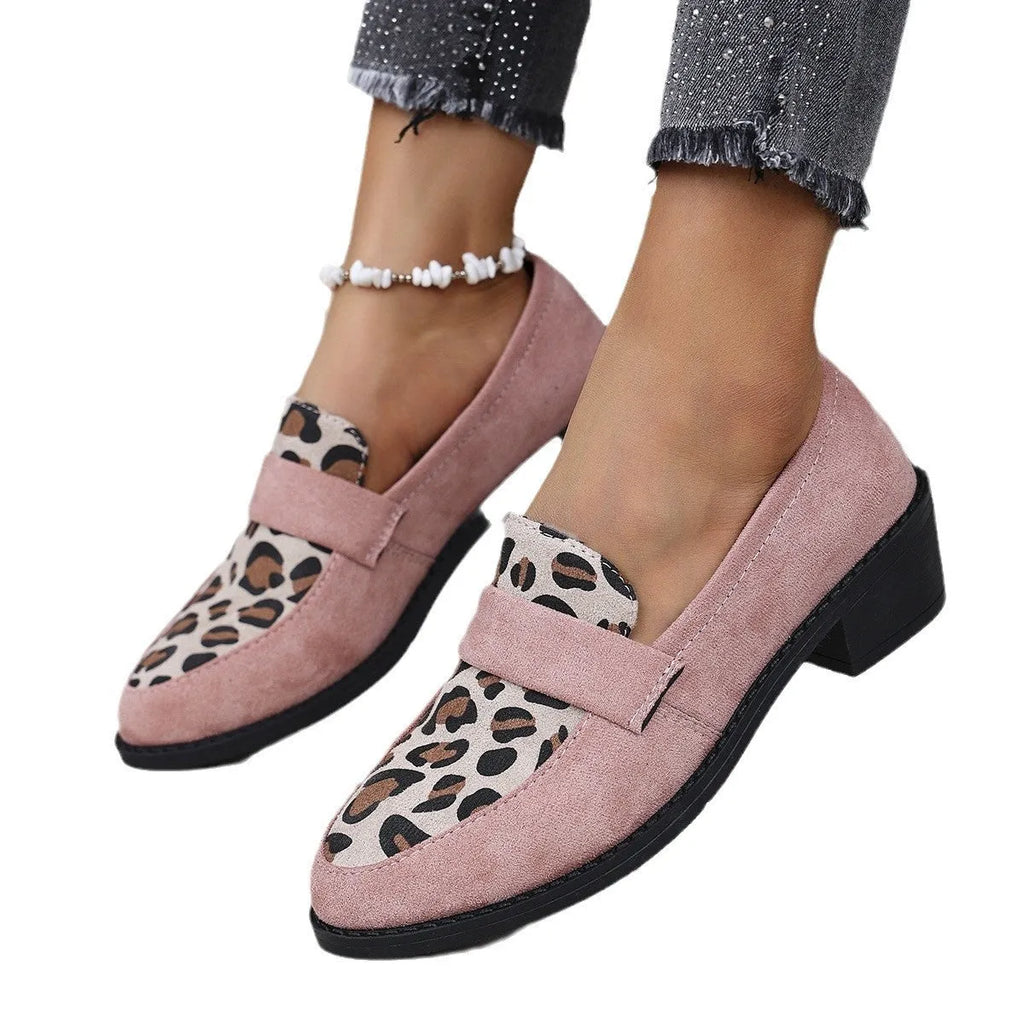 Leopard print suede slip-on pump with chunky heel in brown, shown from the side.