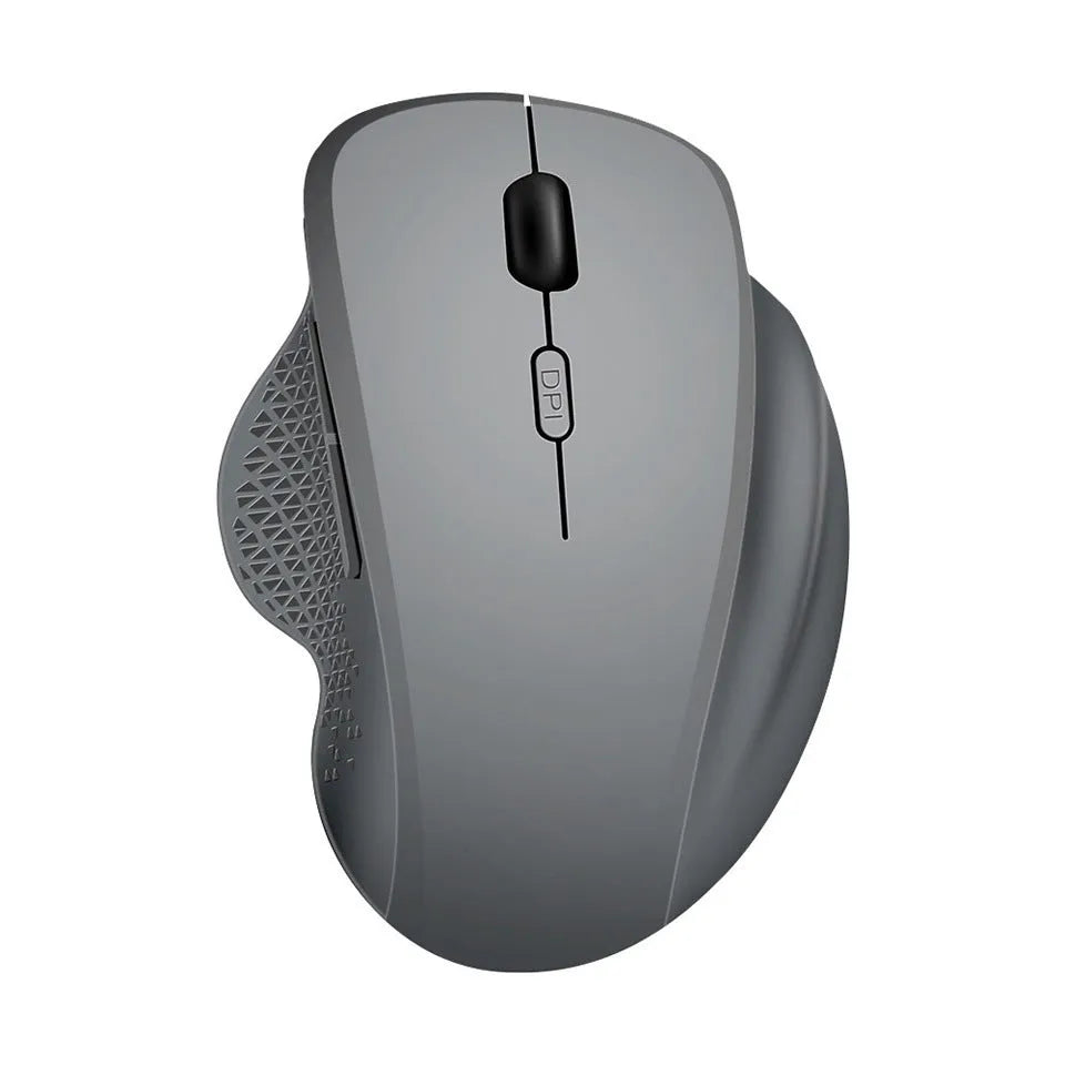 Black wireless laptop mouse with USB-C charging cable on desk next to laptop