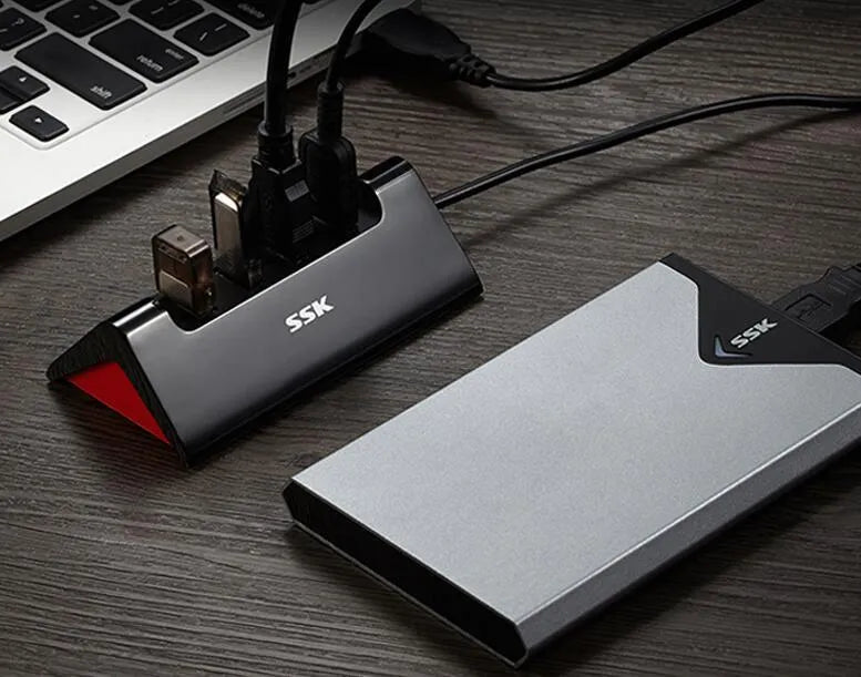 Black USB expansion dock with four ports and micro USB power connector