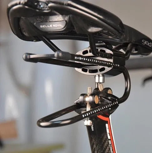 Black bicycle seatpost suspension device on bike showing spring steel alloy construction