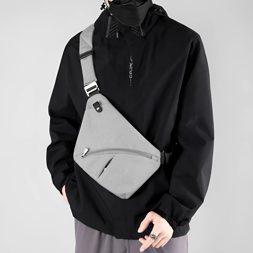 Men's grey oxford cloth shoulder chest bag with letter pattern, shown in left shoulder configuration