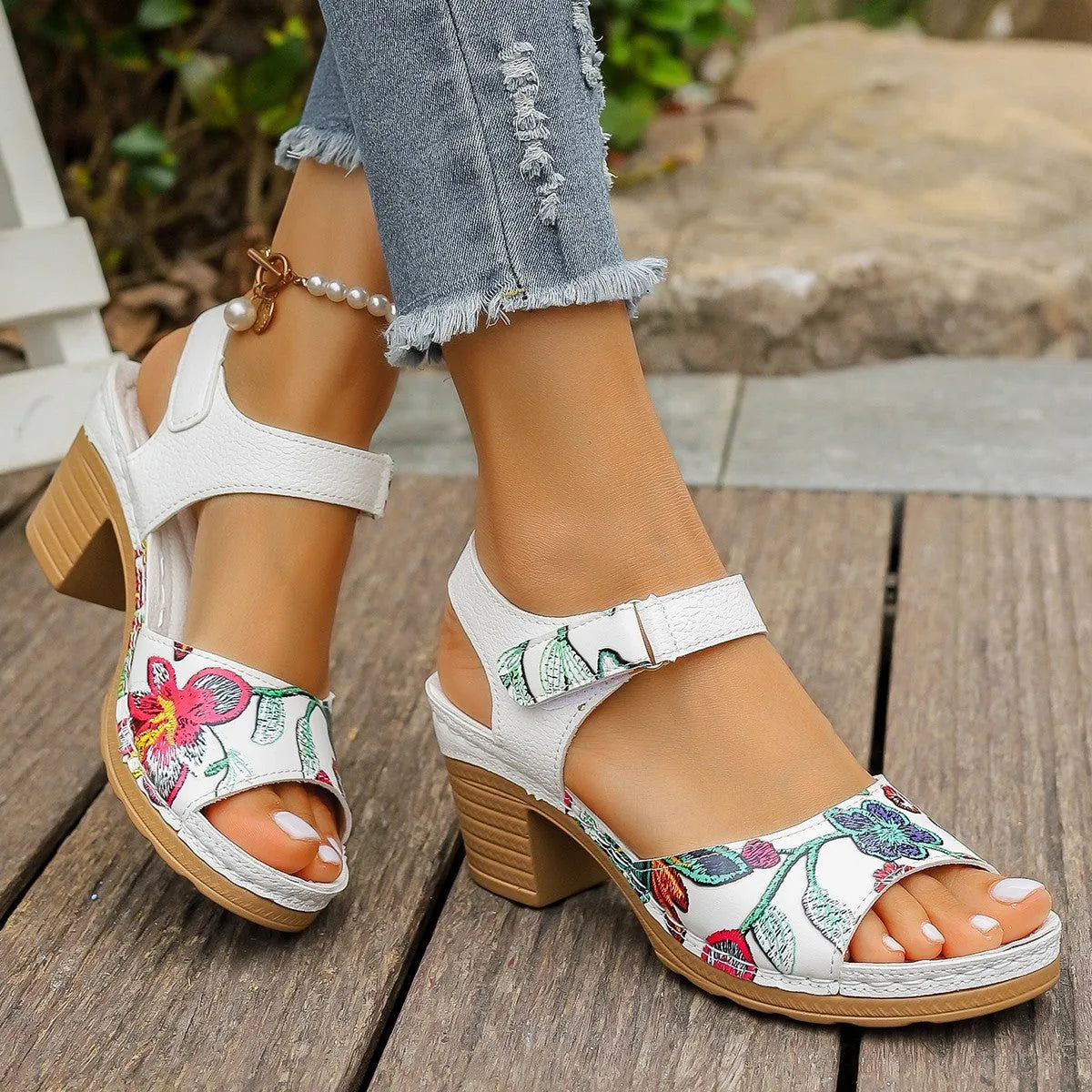 White women's casual high heel sandals with a prominent Velcro strap buckle closure.
