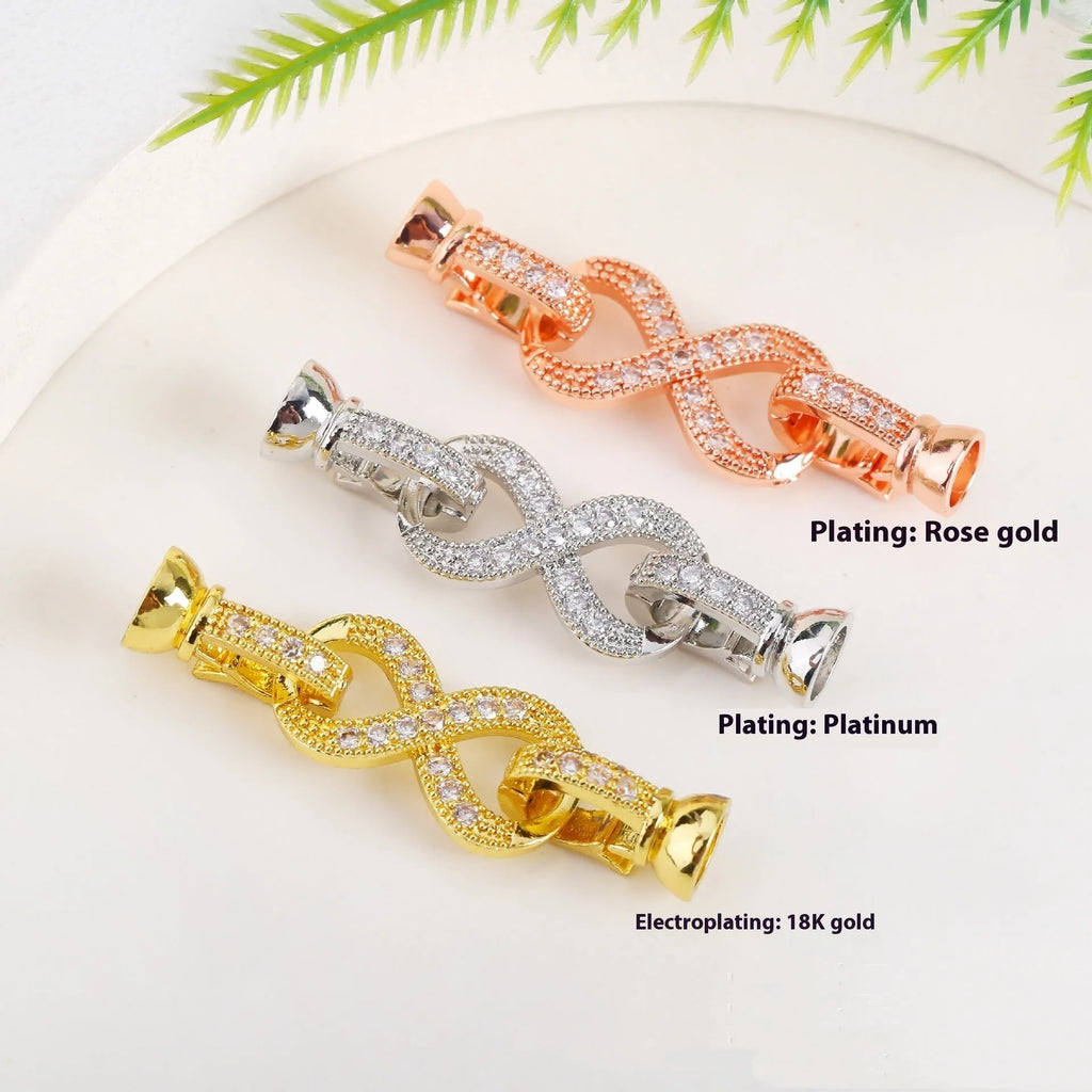 Small gold-coloured metal necklace clasp with a chain buckle for DIY jewellery making.