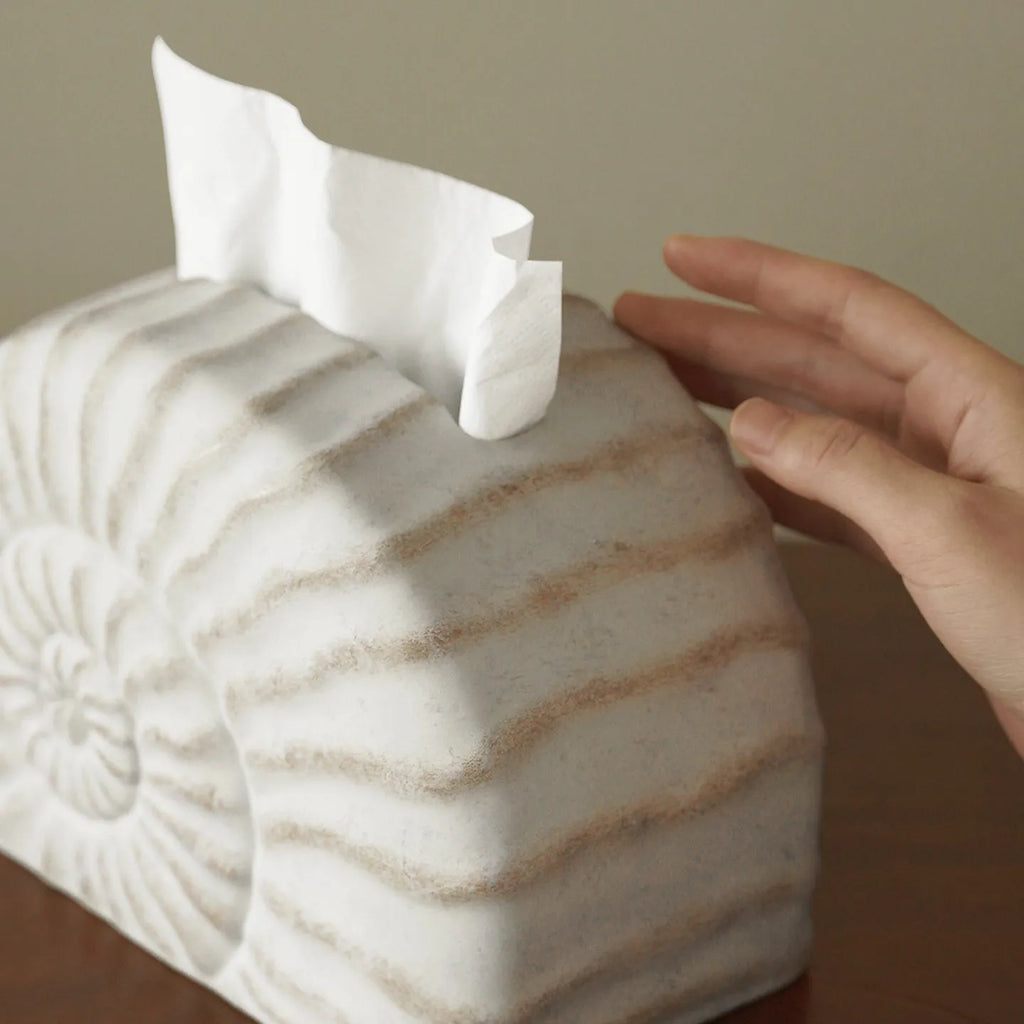 Conch ramble coloured resin decorative tissue box cover with a modern simple design.