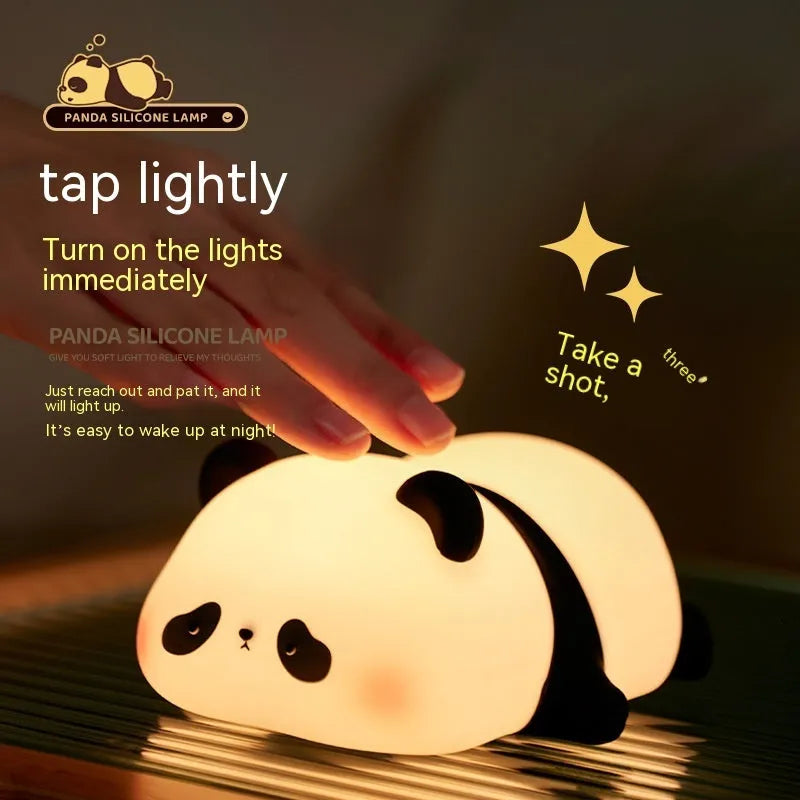 Cartoon panda head rechargeable night light with warm white glow on bedside table