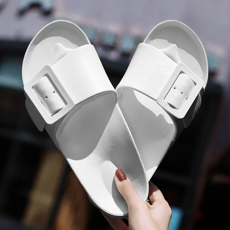 Grey Blue women's EVA flip-flop slippers with a silver buckle strap on a white background.