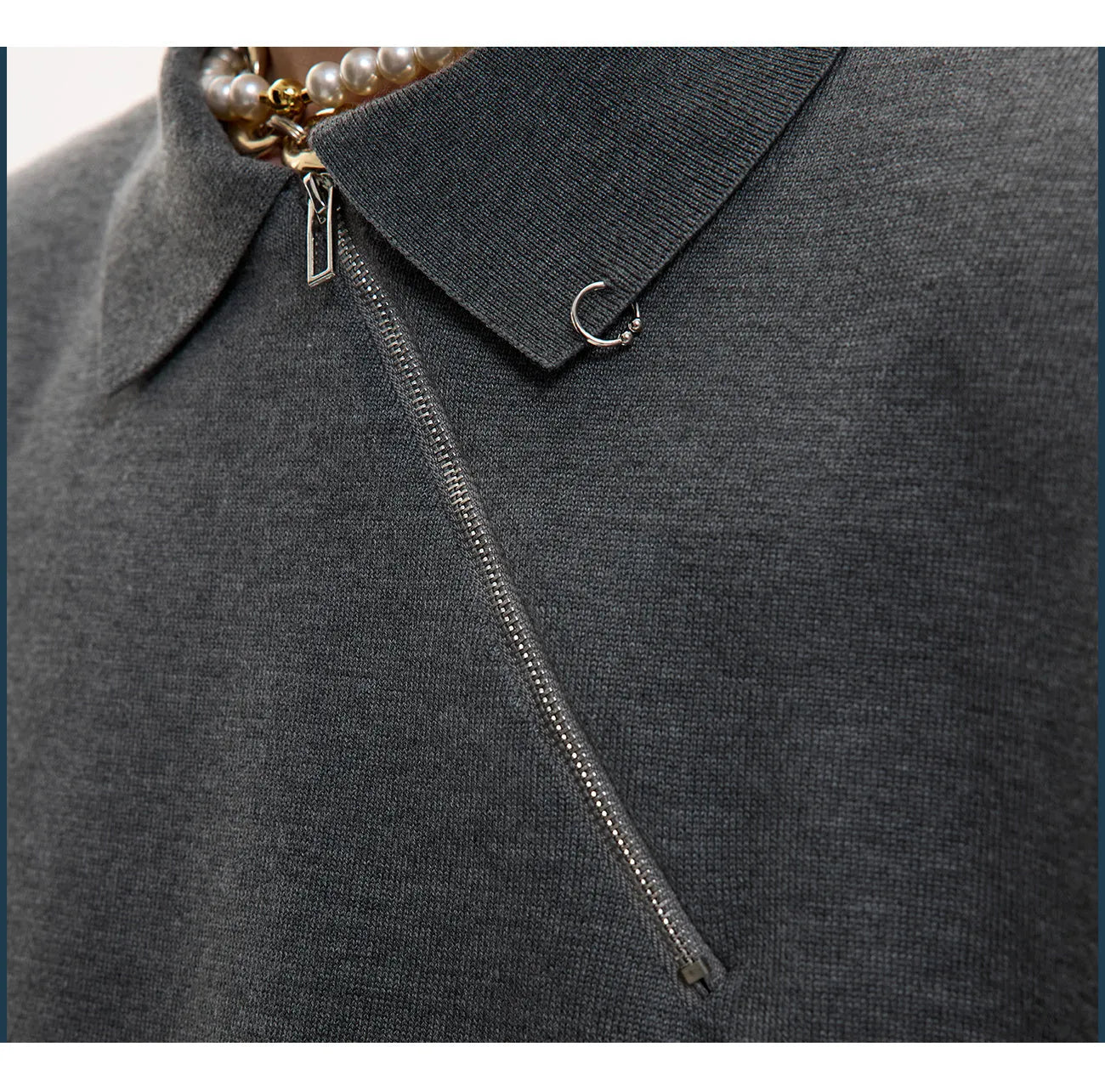 Men's slim-fit black knitted polo shirt with an oblique diagonal zipper and lapel collar.