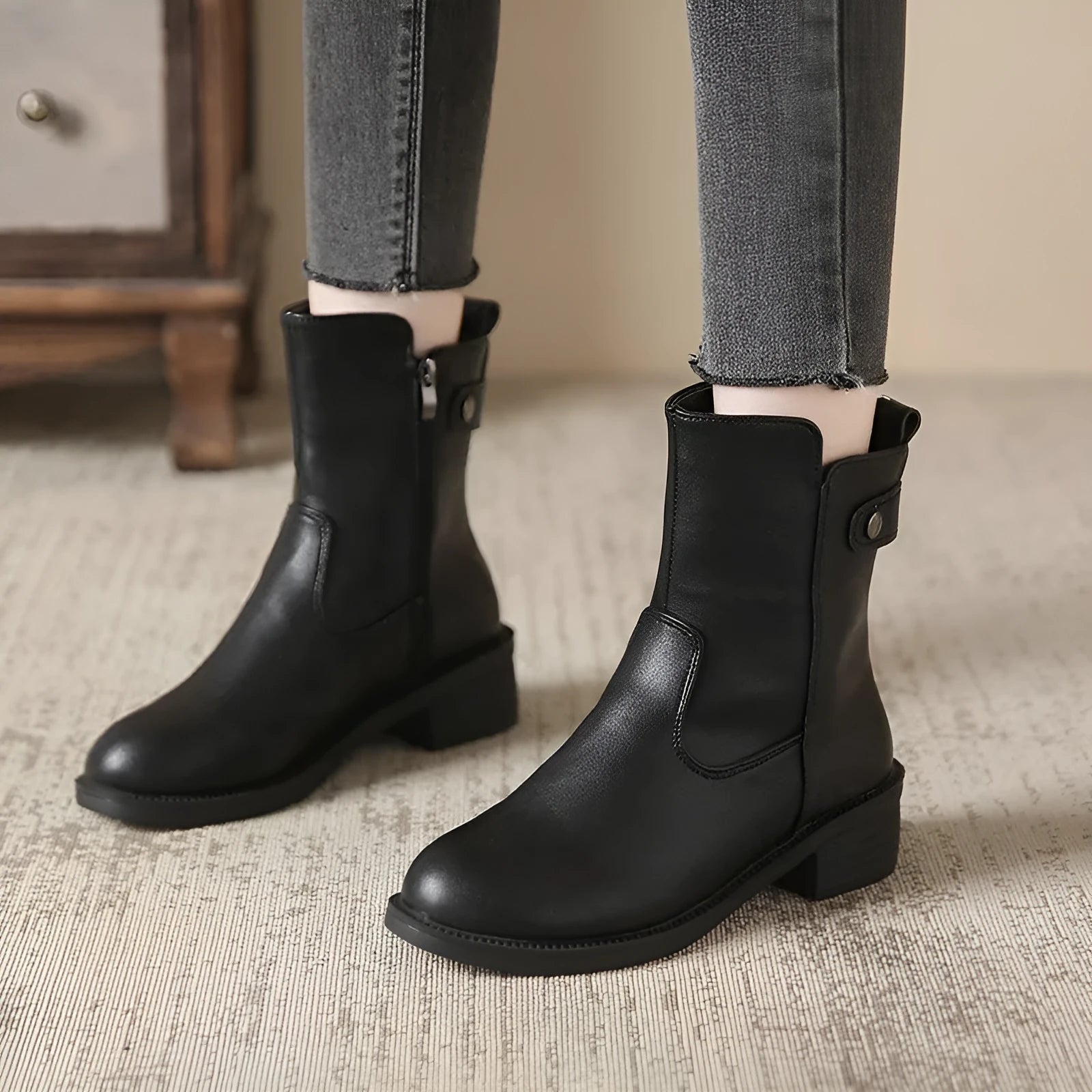 Women's black side zip ankle boots with round toe and low rubber sole