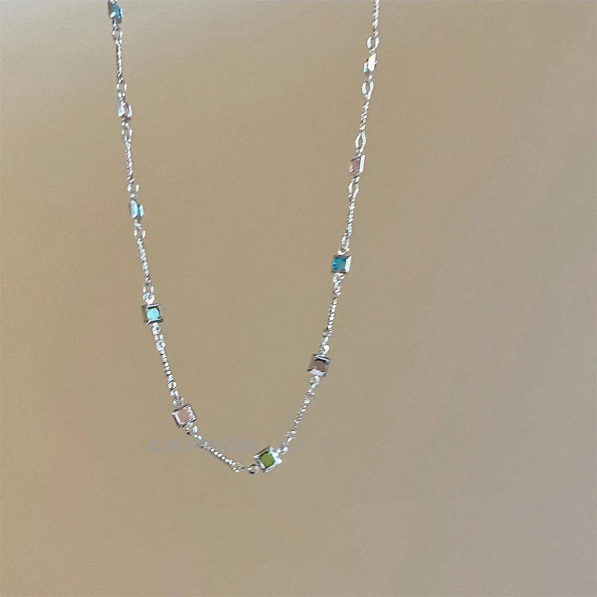 Square geometry clavicle chain necklace with artificial crystal and quadrilateral elements in gold finish