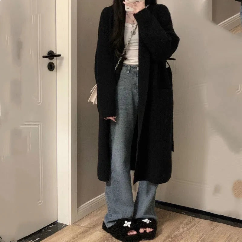 Women's loose knitted chenille cardigan in dark grey showing 3D pattern texture